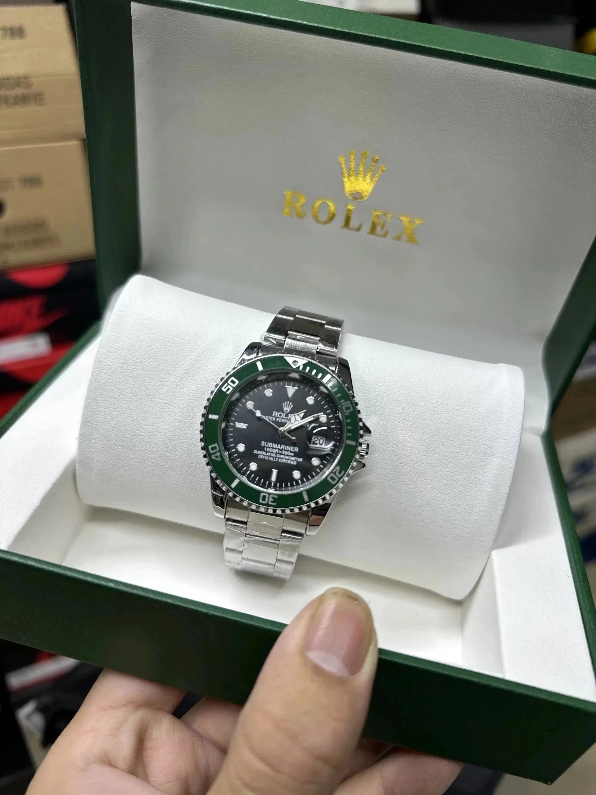 Rolex Submariner Date iconic luxury Watch Green and Silver