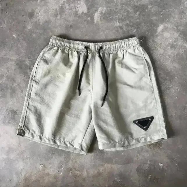 Prada Triangle Plaque Casual Shorts Beige